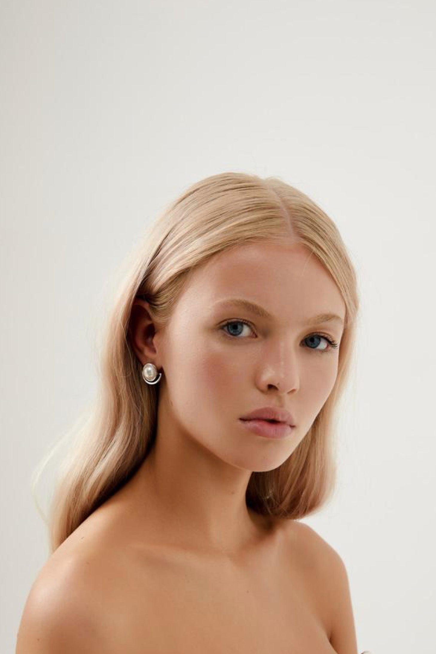 Girl Wearing Florence Elegant Pearl Stud Wedding Earrings- Silver