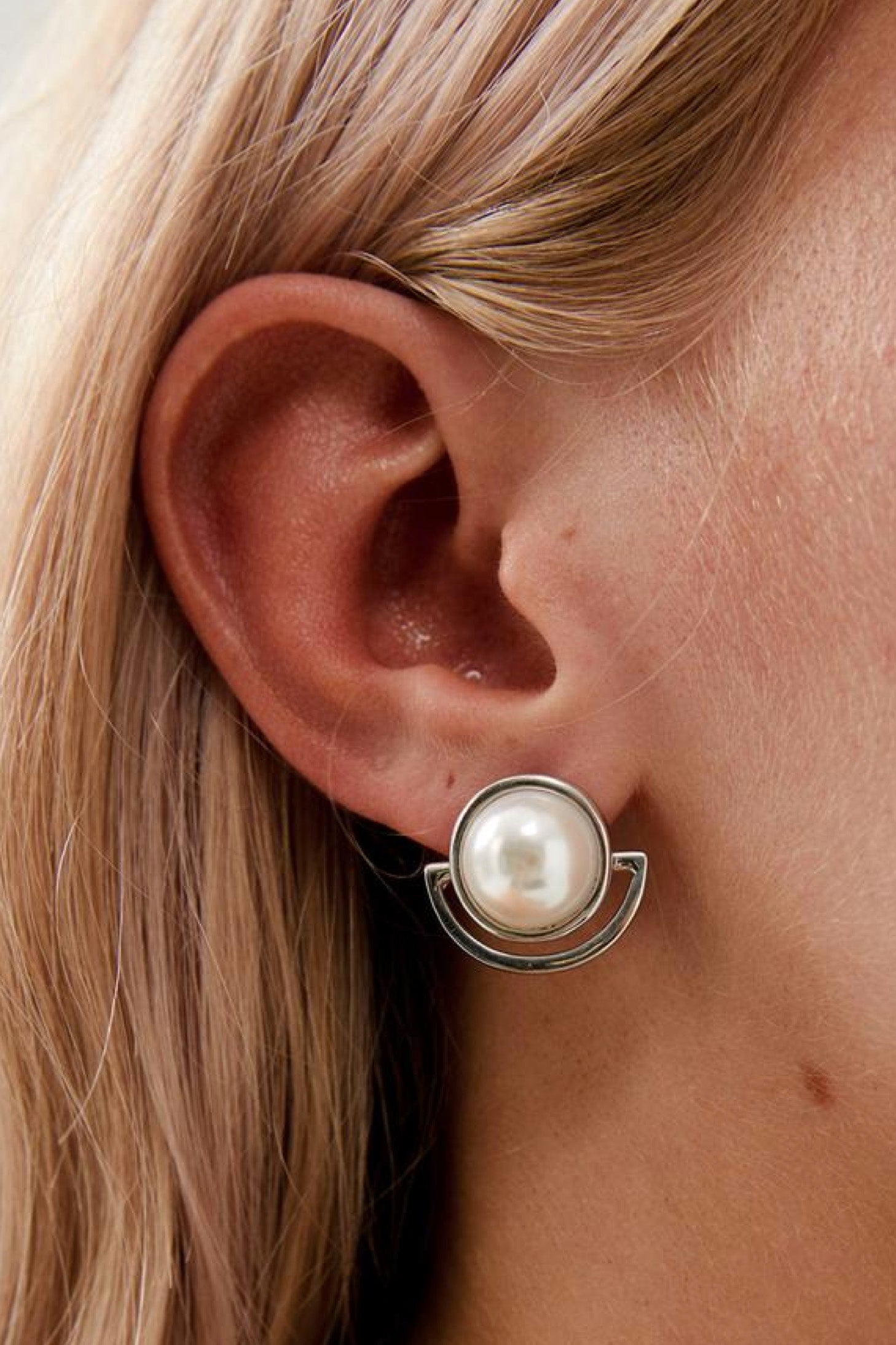 Closeup view of Florence Elegant Pearl Stud Wedding Earrings- Silver