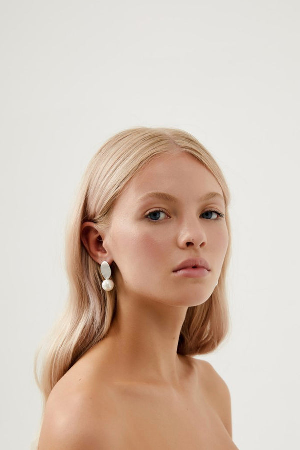 girl wearing Kallista Pearl Drop Earrings- Silver