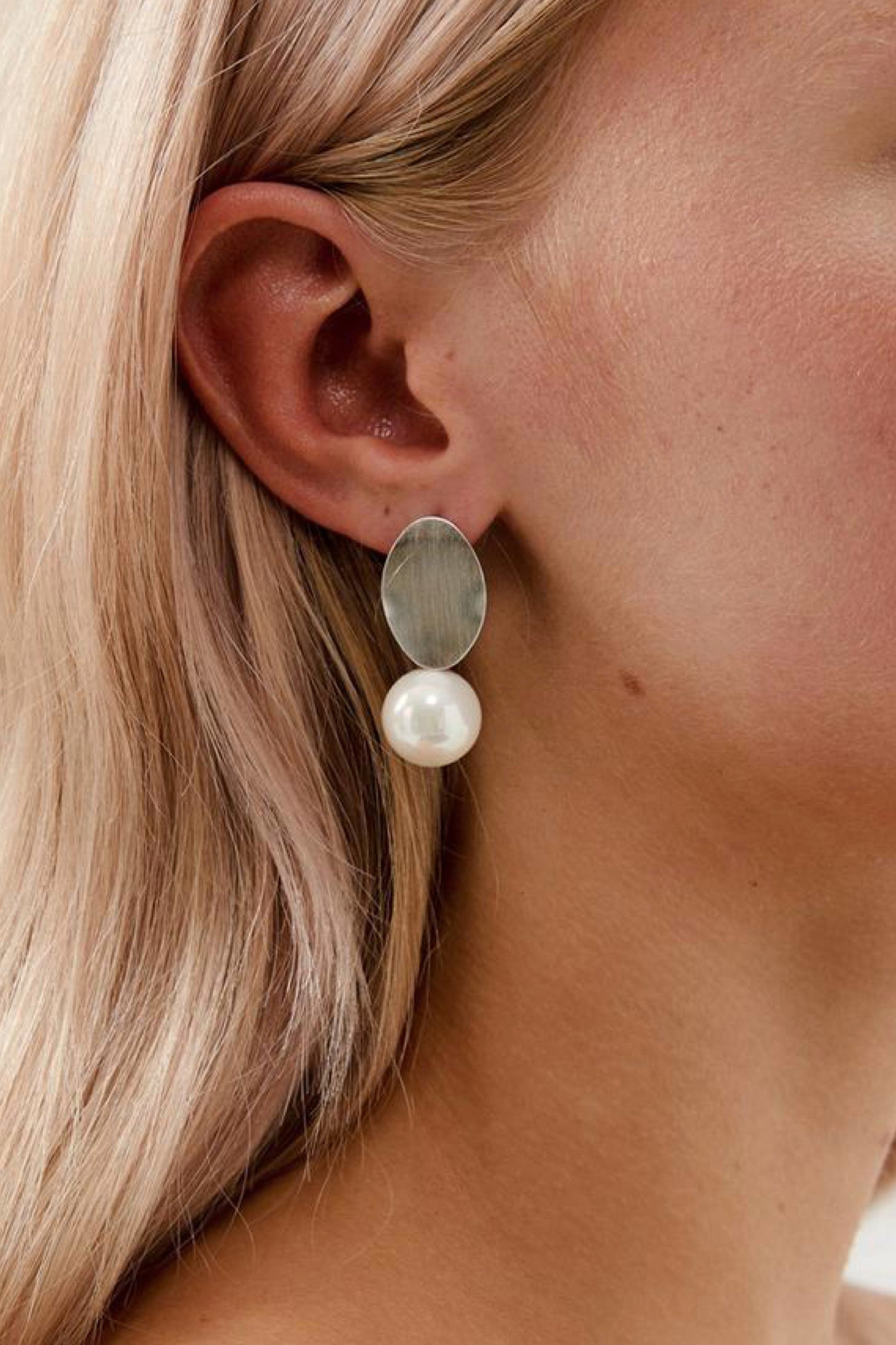 Closeup view of Kallista Pearl Drop Earrings- Silver