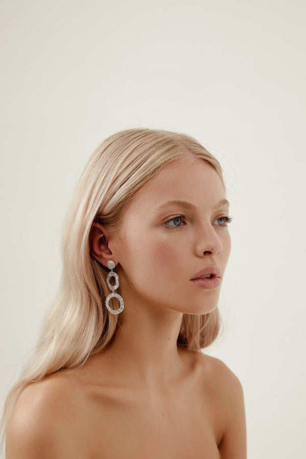 Girl Wearing Tyler Statement Diamond Earrings- Silver